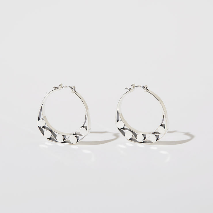 Silver hoops with graphic details reminiscent of lace