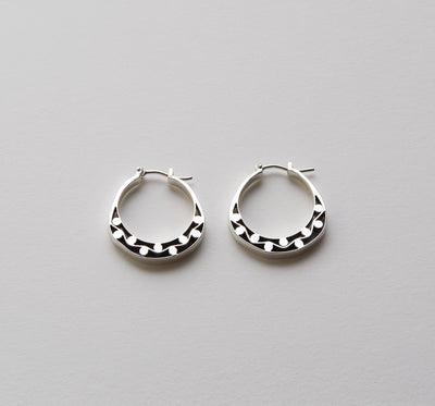 Silver hoops with graphic details 