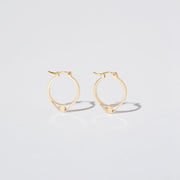 14K Gold hoops with graphic details reminiscent of lace. These Earrings are made of Fairmined Gold, extracted from Fair trade mines in Colombia and Peru.