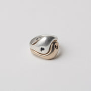 YinYang rings represent the yin-yang symbol. They are composed of two rings, one in silver and one in brass. They fit perfectly together but also come apart as two separate rings. 