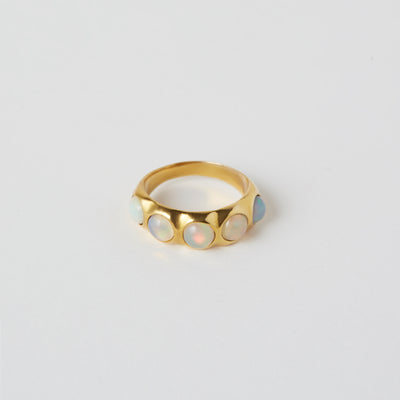 gold ring with lots of opals 