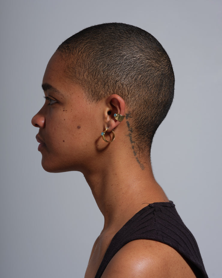 picture of model with ear gem cuff and gem hoops  