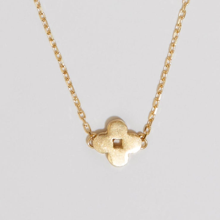 Gold plated sterling silver necklace of a golden clover on fine chain