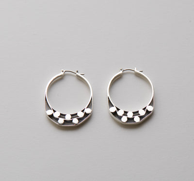 Silver hoops with graphic detailsSilver hoops with graphic details reminiscent of lace