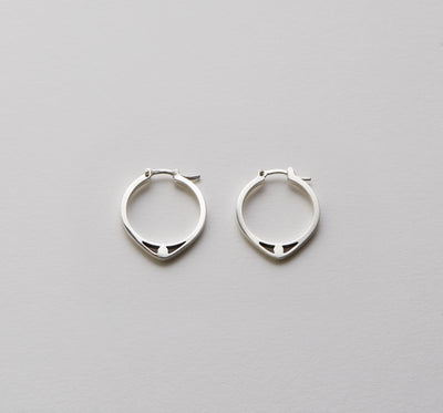 silver fine hoops with detail of an eye